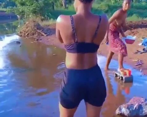 African Girl Showing Breasts In A River In Public (18+)
